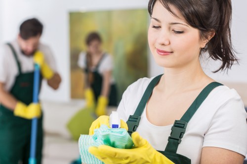 Trained Battersea cleaners using PPE during a cleaning task