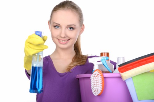 Supervisor checking cleaning safety procedures with staff