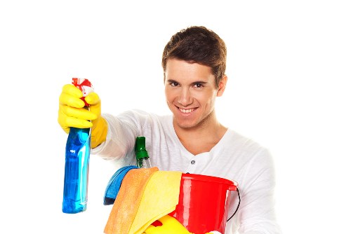 Technician performing oven cleaning in a Battersea home